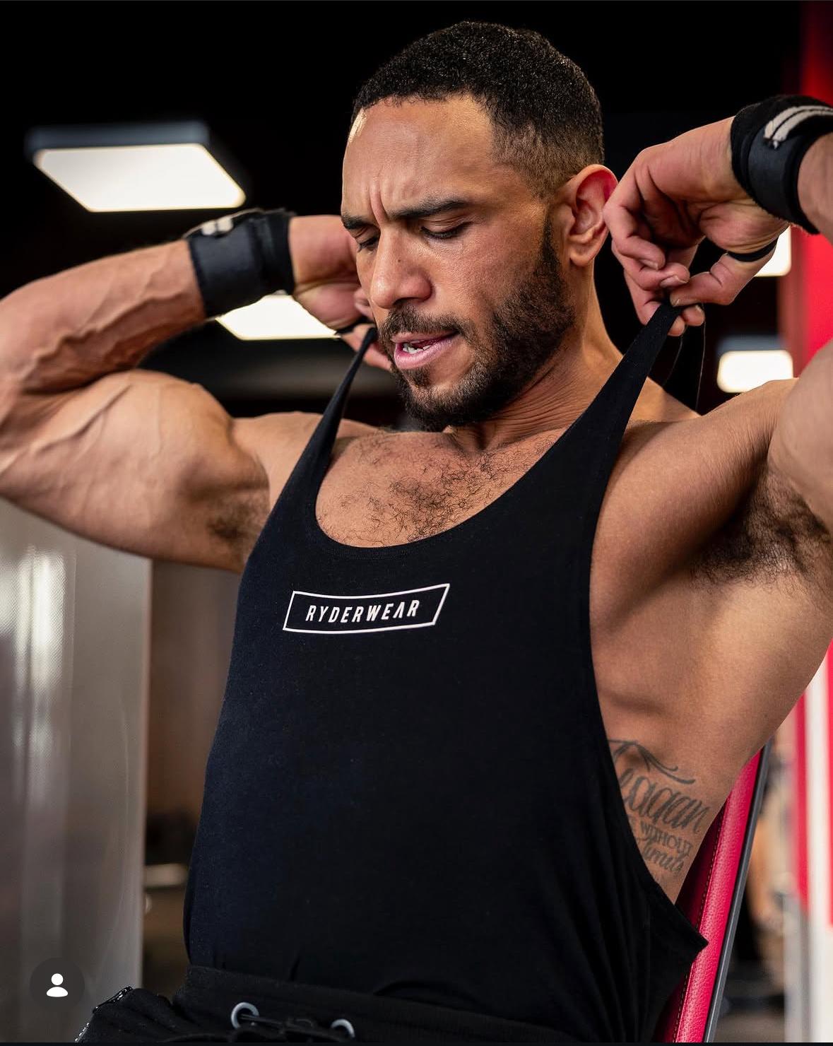 Online fitness coach training in a gym as part of VitalVault Fitness personalised coaching support.